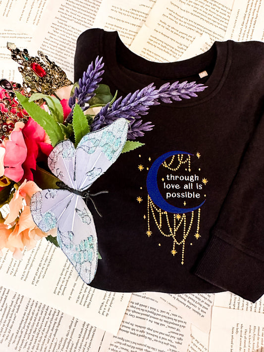 Through Love, All is Possible Embroidered Sarah J. Maas Licensed Unisex organic sweatshirt